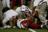 DETROIT, MI - SEPTEMBER 27: Defensive tackle Albert Haynesworth #92 of the Washington Redskins lays on the field injured as he is attended to by trainers in the first half against the Detroit Lions at Ford Field on September 27, 2009 in Detroit, Michigan. (Photo by Scott Boehm/Getty Images)