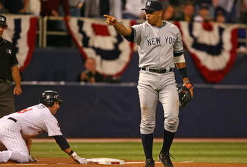 MINNEAPOLIS - OCTOBER 11: Alex Rodriguez #13 of the New York Yankees points to teammate Jorge Posada after he tagged out Nick Punto #8 of the Minnesota Twins in Game Three of the ALDS during the 2009 MLB Playoffs at the Hubert H. Humphrey Metrodome on October 11, 2009 in Minneapolis, Minnesota. (Photo by Jonathan Daniel/Getty Images)