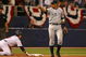MINNEAPOLIS - OCTOBER 11: Alex Rodriguez #13 of the New York Yankees points to teammate Jorge Posada after he tagged out Nick Punto #8 of the Minnesota Twins in Game Three of the ALDS during the 2009 MLB Playoffs at the Hubert H. Humphrey Metrodome on October 11, 2009 in Minneapolis, Minnesota. (Photo by Jonathan Daniel/Getty Images)