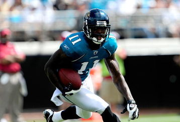 JACKSONVILLE, FL - SEPTEMBER 20:  Mike Sims-Walker #11 of the Jacksonville Jaguars runs for yardage during the game against the Arizona Cardinals at Jacksonville Municipal Stadium on September 20, 2009 in Jacksonville, Florida.  (Photo by Sam Greenwood/Getty Images)
