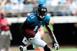 JACKSONVILLE, FL - SEPTEMBER 20:  Mike Sims-Walker #11 of the Jacksonville Jaguars runs for yardage during the game against the Arizona Cardinals at Jacksonville Municipal Stadium on September 20, 2009 in Jacksonville, Florida.  (Photo by Sam Greenwood/Getty Images)