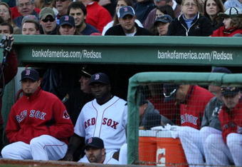 BOSTON - OCTOBER 11:  Pitcher Josh Beckett #19 and David Ortiz #34 of the Boston Red Sox watch as the Los Angeles Angels of Anaheim celebrate thier 7-6 victory in Game Three to win the ALDS during the 2009 MLB Playoffs at Fenway Park on October 11, 2009 in Boston, Massachusetts.  (Photo by Elsa/Getty Images)
