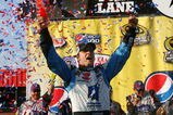 FONTANA, CA - OCTOBER 11:  Jimmie Johnson, driver of the #48 Lowe's Chevrolet, celebrates in victory lane after winning the NASCAR Sprint Cup Series Pepsi 500 at Auto Club Speedway on October 11, 2009 in Fontana, California.  (Photo by Jason Smith/Getty Images for NASCAR)