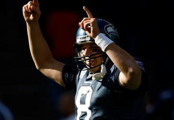 SEATTLE, WA - OCTOBER 11:  Quarterback Matt Hasselbeck #8 of the Seattle Seahawks celebrates a touchdown pass in te second quarter against the Jacksonville Jaguars at Qwest Field on October 11, 2009 in Seattle, Washington.  (Photo by Jonathan Ferrey/Getty Images)