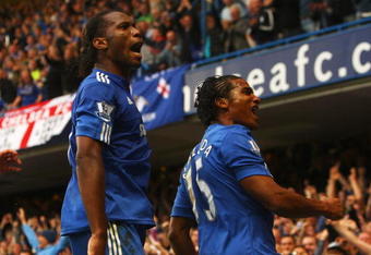 LONDON - OCTOBER 04:  Florent Malouda of Chelsea (R) celebrates with team mate Didier Drogba as he scores their second goal during the Barclays Premier League match between Chelsea and Liverpool at Stamford Bridge on October 4, 2009 in London, England.  (Photo by Ian Walton/Getty Images)