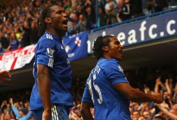 LONDON - OCTOBER 04:  Florent Malouda of Chelsea (R) celebrates with team mate Didier Drogba as he scores their second goal during the Barclays Premier League match between Chelsea and Liverpool at Stamford Bridge on October 4, 2009 in London, England.  (Photo by Ian Walton/Getty Images)
