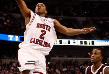 TAMPA, FL - MARCH 13:  Devan Downey #2 of the South Carolina Gamecocks makes a layup around Dee Bost #3 of the Mississippi State Bulldogs during the quaterfinal round of the SEC Men's Basketball Tournament on March 13, 2009 at The St. Pete Times Forum in Tampa, Florida.  (Photo by Chris Graythen/Getty Images)