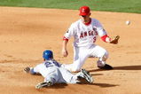 ANAHEIM, CA - OCTOBER 01:  Julio Borbon #29 of the Texas Rangers slides safely into second base with a double as the ball gets away from Brandon Wood #3 of the Los Angeles Angels of Anaheim in the fifth inning at Angel Stadium on October 1, 2009 in Anaheim, California. The Rangers defeated the Angels 11-3.  (Photo by Jeff Gross/Getty Images)