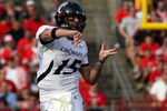 PISCATAWAY, NJ - SEPTEMBER 07:  Tony Pike #15 of the Cincinnati Bearcats throws a pass against the Rutgers Scarlet Knights at Rutgers Stadium on September 7, 2009 in Piscataway, New Jersey.  (Photo by Jim McIsaac/Getty Images)