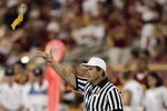 LOS ANGELES - SEPTEMBER 11:  Referee Larry Farina throws a yellow flag during the NCAA game between the University of Southern California Trojans and the Colorado State University Rams at the Los Angeles Memorial Coliseum on September 11, 2004 in Los Angeles, California.  USC won 49-0.  (Photo by Doug Benc/Getty Images)