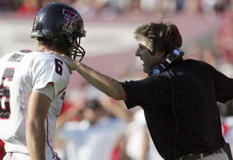 COLLEGE STATION, TX -SEPTEMBER 30:  Quarterback Graham Harrell #6 of the Texas Tech Red Raiders talks with head coach Mike Leach during play against the Texas A&M Aggies at Kyle Field on September 30, 2006 in College Station, Texas.  (Photo by Ronald Martinez/Getty Images)