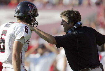 COLLEGE STATION, TX -SEPTEMBER 30:  Quarterback Graham Harrell #6 of the Texas Tech Red Raiders talks with head coach Mike Leach during play against the Texas A&M Aggies at Kyle Field on September 30, 2006 in College Station, Texas.  (Photo by Ronald Martinez/Getty Images)