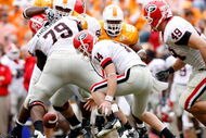 KNOXVILLE, TN - OCTOBER 10: Joe Cox #14 of the Georgia Bulldogs funmbles the ball during the SEC game against the Tennessee Volunteers at Neyland Stadium on October 10, 2009 in Knoxville, Tennessee. (Photo by Andy Lyons/Getty Images)