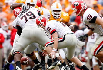 KNOXVILLE, TN - OCTOBER 10: Joe Cox #14 of the Georgia Bulldogs funmbles the ball during the SEC game against the Tennessee Volunteers at Neyland Stadium on October 10, 2009 in Knoxville, Tennessee. (Photo by Andy Lyons/Getty Images)