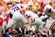 KNOXVILLE, TN - OCTOBER 10: Joe Cox #14 of the Georgia Bulldogs funmbles the ball during the SEC game against the Tennessee Volunteers at Neyland Stadium on October 10, 2009 in Knoxville, Tennessee. (Photo by Andy Lyons/Getty Images)