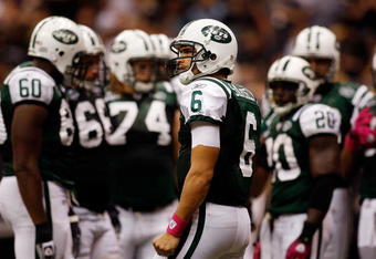 NEW ORLEANS - OCTOBER 04:  Mark Sanchez #6 of the New York Jets waits to call a play against the New Orleans Saints at the Louisana Superdome on October 4, 2009 in New Orleans, Louisiana.  (Photo by Chris Graythen/Getty Images)