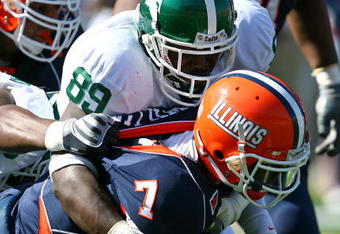 CHAMPAIGN, IL - OCTOBER 10: Juice Williams #7 of the Illinois Fighting Illini is sacked by Colin Neely #89 of the Michigan State Spartans on October 10, 2009 at Memorial Stadium at the University of Illinois in Champaign, Illinois. Michigan State defeated Illinois 24-14. (Photo by Jonathan Daniel/Getty Images)