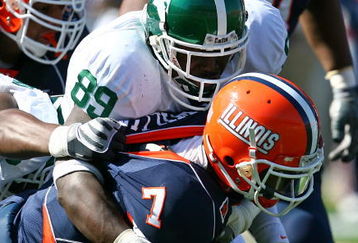 CHAMPAIGN, IL - OCTOBER 10: Juice Williams #7 of the Illinois Fighting Illini is sacked by Colin Neely #89 of the Michigan State Spartans on October 10, 2009 at Memorial Stadium at the University of Illinois in Champaign, Illinois. Michigan State defeated Illinois 24-14. (Photo by Jonathan Daniel/Getty Images)