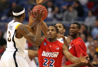 MINNEAPOLIS - MARCH 20:  Paul Williams #22 of the Dayton Flyers defends against Devin Ebanks #3 of the West Virginia Moutaineers during the first round of the NCAA Division I Men's Basketball Tournament at the Hubert H. Humphrey Metrodome on March 20, 2009 in Minneapolis, Minnesota. Dayton won 68-60. (Photo by Jonathan Daniel/Getty Images)