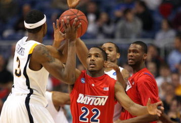 MINNEAPOLIS - MARCH 20:  Paul Williams #22 of the Dayton Flyers defends against Devin Ebanks #3 of the West Virginia Moutaineers during the first round of the NCAA Division I Men's Basketball Tournament at the Hubert H. Humphrey Metrodome on March 20, 2009 in Minneapolis, Minnesota. Dayton won 68-60. (Photo by Jonathan Daniel/Getty Images)