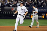 NEW YORK - OCTOBER 09: Mark Teixeira #25 of the New York Yankees celebrates as he runs past Nick Punto #8 after hitting a walk off home run in the eleventh inning against the Minnesota Twins in Game Two of the ALDS during the 2009 MLB Playoffs at Yankee Stadium on October 9, 2009 in the Bronx borough of New York City. (Photo by Jim McIsaac/Getty Images) 