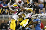 DETROIT , MI - OCTOBER 11: Ryan Clark #25, Ryan Mundy #29 and Ike Taylor #24 of the Pittsburgh Steelers break up a pass in the end zone intended for Bryant Johnson #80 of the Detroit Lions on October 11, 2009 at Ford Field in Detroit, Michigan. Pittsburgh won the game 28-20.  (Photo by Gregory Shamus/Getty Images)