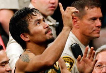 LAS VEGAS - MAY 02:  Manny Pacquiao of the Philippines celebrates after knocking out Ricky Hatton of England in the second round during their junior welterweight title fight at the MGM Grand Garden Arena May 2, 2009 in Las Vegas, Nevada.  (Photo by Ethan Miller/Getty Images)