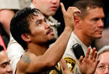 LAS VEGAS - MAY 02:  Manny Pacquiao of the Philippines celebrates after knocking out Ricky Hatton of England in the second round during their junior welterweight title fight at the MGM Grand Garden Arena May 2, 2009 in Las Vegas, Nevada.  (Photo by Ethan Miller/Getty Images)