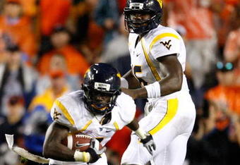 AUBURN, AL - SEPTEMBER 19:  Quarterback Jarrett Brown #16 and Noel Devine #7 of the West Virginia Mountaineers against the Auburn Tigers at Jordan-Hare Stadium on September 19, 2009 in Auburn, Alabama.  (Photo by Kevin C. Cox/Getty Images)
