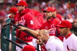 ST. LOUIS, MO - OCTOBER 10:  Albert Pujols #5 of the St. Louis Cardinals and teammates look on from the dugout after the Los Angeles win the NLDS  5-1 during the 2009 MLB Playoffs at Busch Stadium on October 10, 2009 in St. Louis, Missouri. (Photo by Dilip Vishwanat/Getty Images)