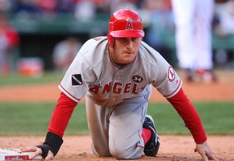 BOSTON - OCTOBER 11:  Pinch runner Reggie Willits #77 of the Los Angeles Angels of Anaheim reacts after being picked-off first base by pitcher Jonathan Papelbon #58 of the Boston Red Sox in the eighth inning of Game Three of the ALDS during the 2009 MLB Playoffs at Fenway Park on October 11, 2009 in Boston,  Massachusetts. (Photo by Jim Rogash/Getty Images)