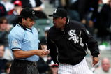 CHICAGO - APRIL 07: Manager Ozzie Guillen #13 of the Chicago White Sox yells at home plate umpire Phil Cuzzi #10 after Cuzzi threw Guillen out of the Opening Day game for arguing from the bench against the Minnesota Twins on April 7, 2008 at U.S. Cellular Field in Chicago, Illinois. (Photo by Jonathan Daniel/Getty Images)