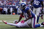 EAST RUTHERFORD, NJ - OCTOBER 11:  Mathias Kiwanuka #94 of the New York Giants forces a fumble against JaMarcus Russell #2 of the Oakland Raiders on October 11, 2009 at Giants Stadium in East Rutherford, New Jersey. The Giants defeated the Raiders 44-7.  (Photo by Jim McIsaac/Getty Images)
