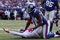 EAST RUTHERFORD, NJ - OCTOBER 11:  Mathias Kiwanuka #94 of the New York Giants forces a fumble against JaMarcus Russell #2 of the Oakland Raiders on October 11, 2009 at Giants Stadium in East Rutherford, New Jersey. The Giants defeated the Raiders 44-7.  (Photo by Jim McIsaac/Getty Images)