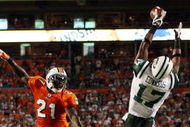 MIAMI - OCTOBER 12:  Wide receiver Braylon Edwards #17 of the New York Jets catches an apparent touchdown pass that was overturned on appeal over cornerback Vontae Davis #21 of the Miami Dolphins at Land Shark Stadium on October 12, 2009 in Miami, Florida. The Dolphins defeated the Jets 31-27.  (Photo by Doug Benc/Getty Images)