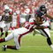 GLENDALE, AZ - OCTOBER 11: Runningback Chris Brown #22 of the Houston Texans runs with the ball after a reception under pressure from Gerald Hayes #54 of the Arizona Cardinals during the NFL game at the Universtity of Phoenix Stadium on October 11, 2009 in Glendale, Arizona. (Photo by Christian Petersen/Getty Images)