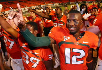 FORT LAUDERDALE, FL - SEPTEMBER 17:  Quarterback Jacory Harris #12 of the Miami Hurricanes celebrates after defeating the Georgia Tech Yellow Jackets at Land Shark Stadium on September 17, 2009 in Fort Lauderdale, Florida. Miami defeated Georgia Tech 33-17.  (Photo by Doug Benc/Getty Images)