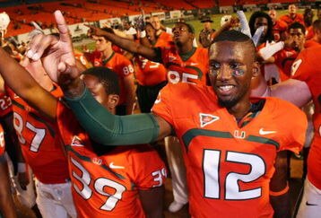FORT LAUDERDALE, FL - SEPTEMBER 17:  Quarterback Jacory Harris #12 of the Miami Hurricanes celebrates after defeating the Georgia Tech Yellow Jackets at Land Shark Stadium on September 17, 2009 in Fort Lauderdale, Florida. Miami defeated Georgia Tech 33-17.  (Photo by Doug Benc/Getty Images)