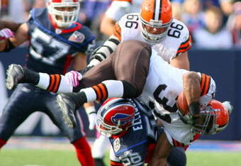 ORCHARD PARK, NY - OCTOBER 11:  Jamal Lewis #31 of the Cleveland Browns tries to jump over Keith Ellison #56 of the Buffalo Bills at Ralph Wilson Stadium on October 11, 2009 in Orchard Park, New York. Cleveland won 6-3.  (Photo by Rick Stewart/Getty Images)