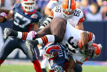 ORCHARD PARK, NY - OCTOBER 11:  Jamal Lewis #31 of the Cleveland Browns tries to jump over Keith Ellison #56 of the Buffalo Bills at Ralph Wilson Stadium on October 11, 2009 in Orchard Park, New York. Cleveland won 6-3.  (Photo by Rick Stewart/Getty Images)