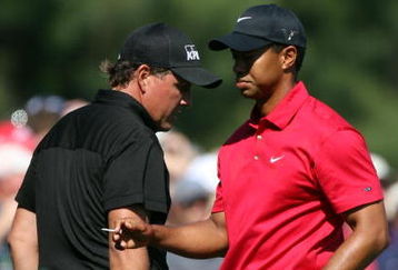 AUGUSTA, GA - APRIL 12:  Phil Mickelson and Tiger Woods walk past one another during the final round of the 2009 Masters Tournament at Augusta National Golf Club on April 12, 2009 in Augusta, Georgia.  (Photo by Ross Kinnaird/Getty Images)