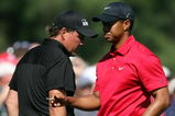 AUGUSTA, GA - APRIL 12:  Phil Mickelson and Tiger Woods walk past one another during the final round of the 2009 Masters Tournament at Augusta National Golf Club on April 12, 2009 in Augusta, Georgia.  (Photo by Ross Kinnaird/Getty Images)