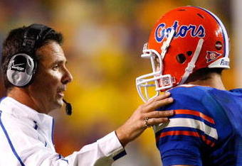 BATON ROUGE, LA - OCTOBER 10:  Head coach Urban Meyer (L) talks with quarterback Tim Tebow #15 of the Florida Gators during the game against the Louisiana State University Tigers at Tiger Stadium on October 10, 2009 in Baton Rouge, Louisiana.  (Photo by Kevin C. Cox/Getty Images)