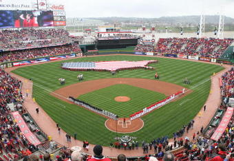 CINCINNATI, OH - APRIL 6:  Both teams line up during the National Anthem of the United States before the opening day game between the Cincinnati Reds against the New York Mets at Great American Ballpark on April 6, 2009 in Cincinnati, Ohio. (Photo by Mark Lyons/Getty Images)