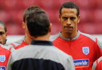 AMSTERDAM, NETHERLANDS - AUGUST 11: Ashley Cole, Frank Lampard, Rio Ferdinand and Wayne Rooney listen to England manager Fabio Capello  during the England Training Session at the Amsterdam Arena on August 11, 2009 in Amsterdam, Netherlands.  (Photo by Michael Regan/Getty Images)
