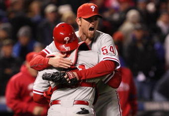 DENVER - OCTOBER 12:  Brad Lidge #54 of the Philadelphia Phillies celebrates with catcher Carlos Ruiz #51 after defeating the Colorado Rockies in Game Four of the NLDS during the 2009 MLB Playoffs at Coors Field on October 12, 2009 in Denver, Colorado.  (Photo by Jed Jacobsohn/Getty Images)