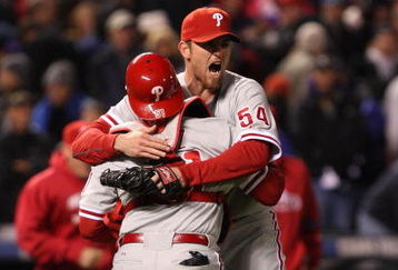 DENVER - OCTOBER 12:  Brad Lidge #54 of the Philadelphia Phillies celebrates with catcher Carlos Ruiz #51 after defeating the Colorado Rockies in Game Four of the NLDS during the 2009 MLB Playoffs at Coors Field on October 12, 2009 in Denver, Colorado.  (Photo by Jed Jacobsohn/Getty Images)