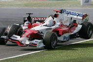 SUZUKA, JAPAN - OCTOBER 9: Jarno Trulli of Italy and Toyota collides with Takuma Sato of Japan and BAR during the Japan F1 Grand Prix at the Suzuka Circuit on October 9, 2005 in Suzuka, Japan. (Photo by Clive Mason/Getty Images)