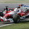 SUZUKA, JAPAN - OCTOBER 9:  Jarno Trulli of Italy and Toyota collides with Takuma Sato of Japan and BAR during the Japan F1 Grand Prix at the Suzuka Circuit on October 9, 2005 in Suzuka, Japan.  (Photo by Clive Mason/Getty Images)
