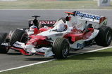 SUZUKA, JAPAN - OCTOBER 9:  Jarno Trulli of Italy and Toyota collides with Takuma Sato of Japan and BAR during the Japan F1 Grand Prix at the Suzuka Circuit on October 9, 2005 in Suzuka, Japan.  (Photo by Clive Mason/Getty Images)
